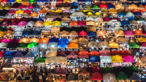 Time lapse view of the colourful, traditional Train Night Market Ratchada in Bangkok, Thailand. 
