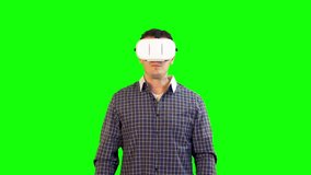 Greenscreen Virtual Reality Man Wearing 360 Headset Quickly Looking Around at Fast Moving Video