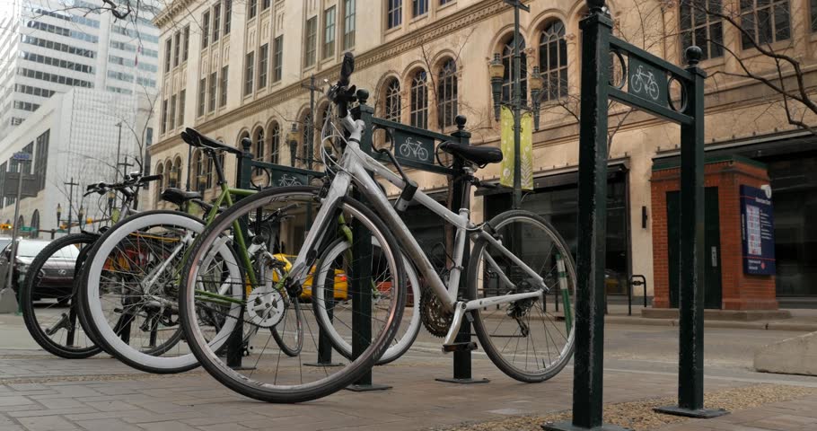 Slider shot of Bicycles parked in bike rack