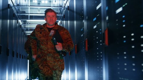 Security Alarm with Flasher Triggered in Data Center. Two Military Men Running in the Corridor full of Server Racks.  
