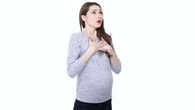 Young healthy pregnant woman doing breathing exercise and touching her belly isolated over white