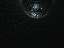 ROTATING MIRROR BALL WITH REFLECTION CAST ONTO WALL - Powered by Shutterstock - Get 15% off with code: PIKWIZARD15