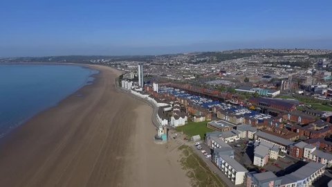 Editorial SWANSEA, UK - APRIL 19, 2017: An aerial view of the Swansea City showing the marina, coastal housing, Leisure centre, Swansea market, County Hall and Meridian Tower.