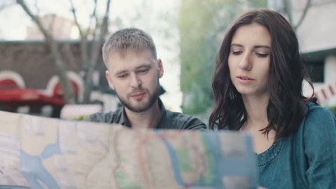 Tourists looking in the map