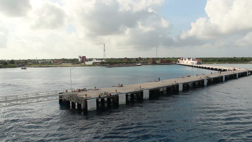 A real time shot of a cruise ship approaching a pier in Cozumel, Mexico.