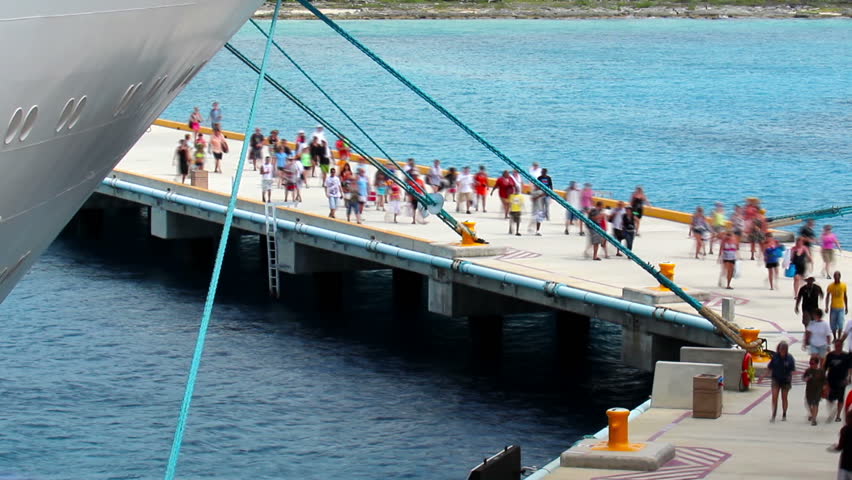 Cruise ship passengers return to their cruise ship at the pier in Cozumel,