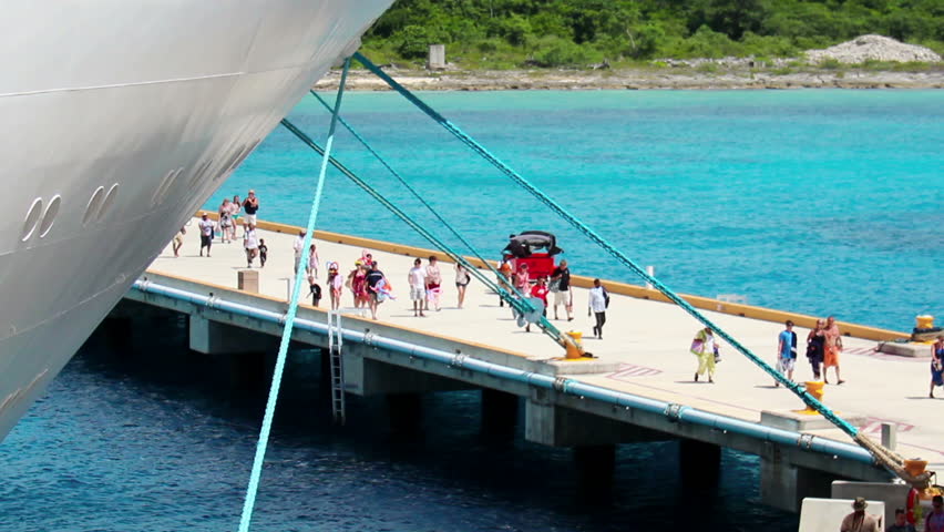 Cruise ship passengers return to their cruise ship at the pier in Cozumel,