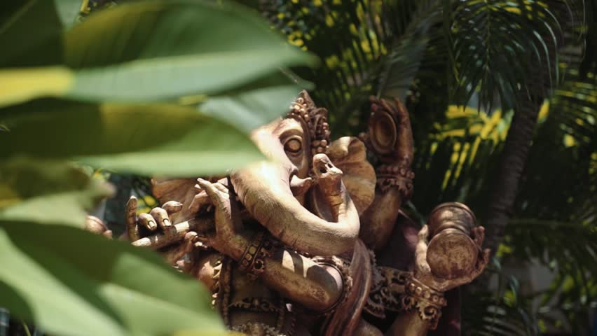 Big statue of hindu deity Ganesha between trees, Bali Royalty-Free Stock Footage #26043839