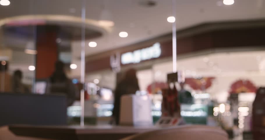 Crowd walking in mall fast-motion. Anonymous crowd of people walking along cafe window. Shallow depth of field. People defocused footage. Vintage brown color grading. | Shutterstock HD Video #26047118