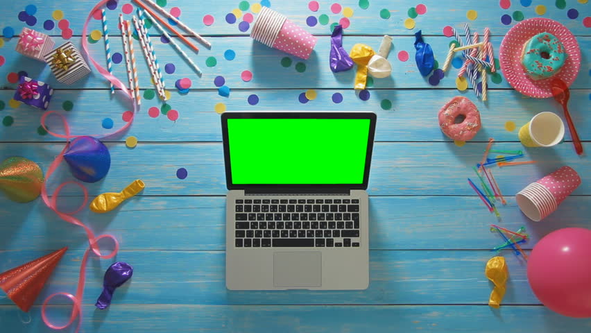 Top view man planning birthday party using laptop computer green screen