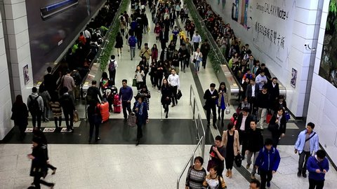 HONG KONG _ DEC 04, 2014 : Time lapse of crowds of people walking in Central MTR subway station in Hong Kong, China 
