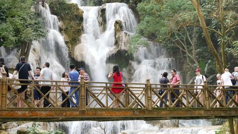 LUANG PRABANG, LAOS - NOV 24, 2016 Tourists at Kuang Si waterfall or Kuang Xi or Tat Kuang Si Falls, South of Luang Prabang.