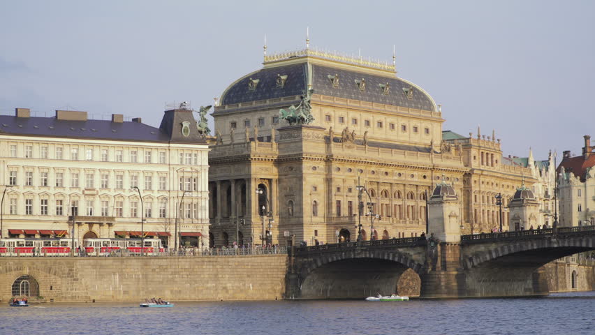 Prague Praha National Theatre Národní Divadlo is known as the alma mater of Czech opera and as the national monument of Czech history  tram moving in front of a building.