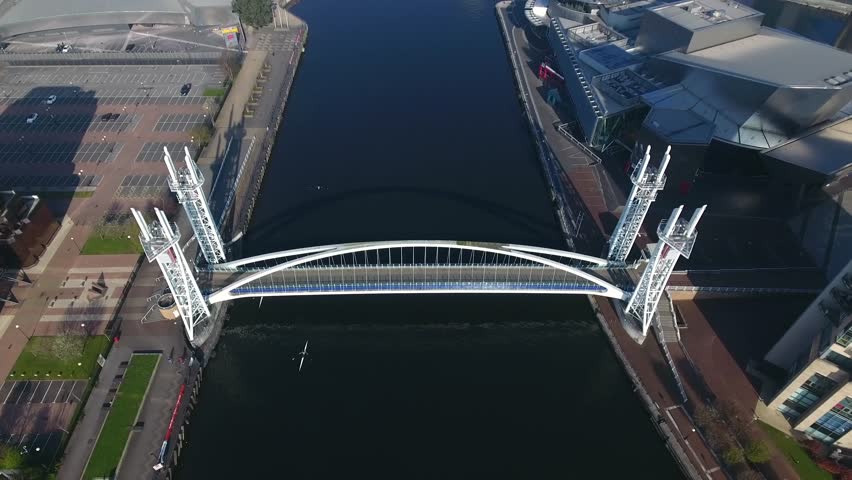 Tilting aerial view of Salford Quays in Manchester, UK.
