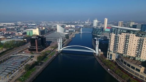 Rising aerial view of Media city and Salford Quays, Manchester, England.