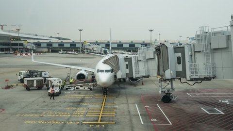 Changi airport, SINGAPORE APRIL 20 , 2017 :  Time lapse Preparing the aircraft before flight Loading of baggage. Food for flight check-in services and equipment to ready before boarding the airplane.
