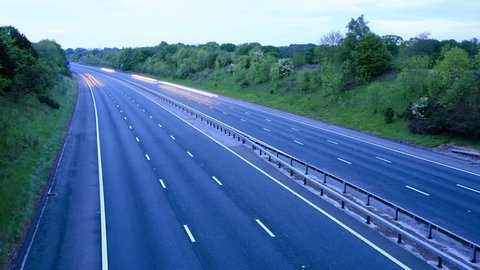 Time lapse of motorway traffic from day to night on the M53 highway in England