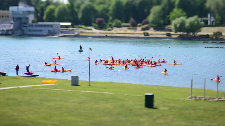 Canoe school at Idroscalo Park of Milan on a late-spring sunny day