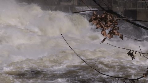 Flooding and fast moving water on river during spring flood and melt