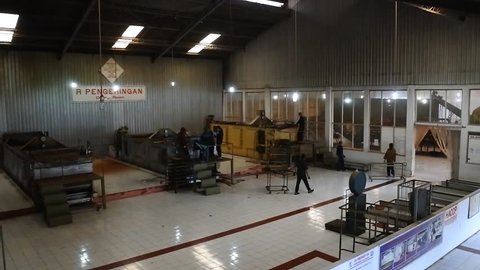 Dieng,Indonesia-January 15,2017: agriculture, manufacture, industry and farming concept - machine grinding tea raw on factory on January 15, 2017 in Wonosobo, Indonesia
