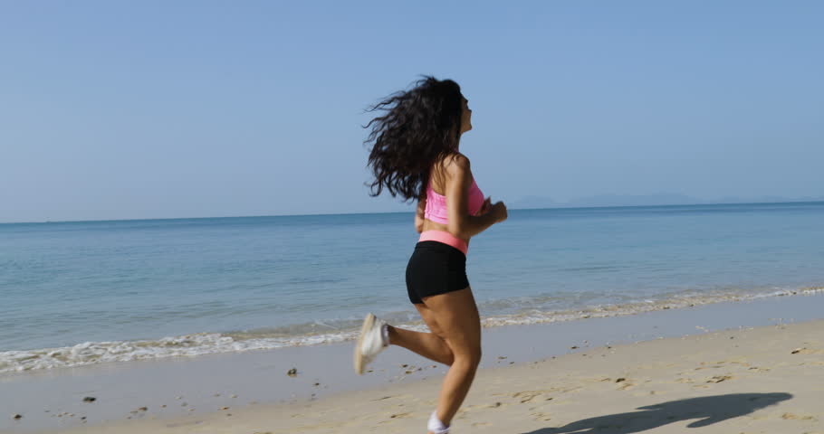Running Girl On Beach Young Woman Athlete Jogging Training Outdoors Exercising On Seaside Fit Beautiful Athletic Female Working Out Side View Slow Motion 60