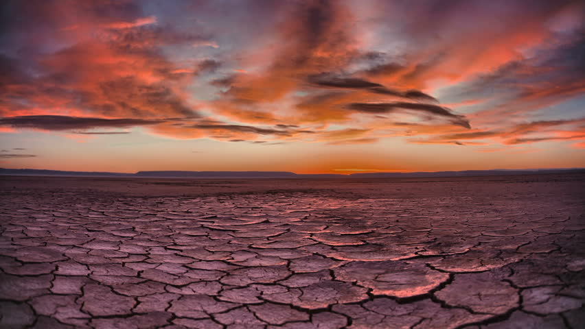 Tracking Sunrise Time Lapse across apocalyptic desert playa wasteland Royalty-Free Stock Footage #26114114