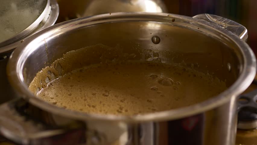 Home Brew Beer making. Boiling of a dark beer liquid in slow motion 4K | Shutterstock HD Video #26115992