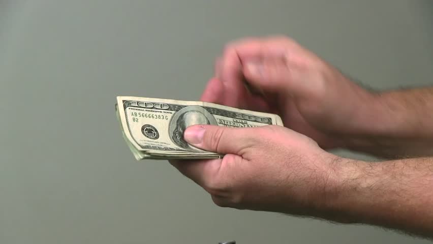 hand holding money shirt