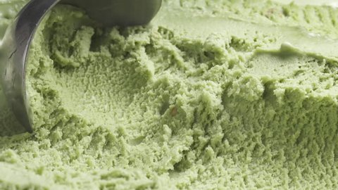 Slow motion of pistachio ice cream being scooped close up, 180fps prores footage