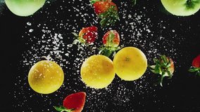 A lot of oranges, apples, strawberries falling into water in slow motion - Powered by Shutterstock - Get 15% off with code: PIKWIZARD15