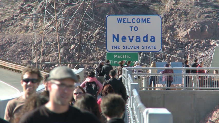 HOOVER DAM, NEVADA FEB 29, 2012: Pedestrians at Welcome to Nevada Sign near
