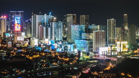 Manila, Philippines - April 18, 2017: Time lapse view of Metro Manila skyline at night in Philippines, dolly shot.