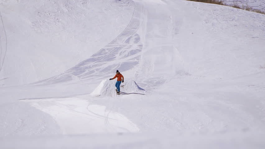 man snowboarder riding