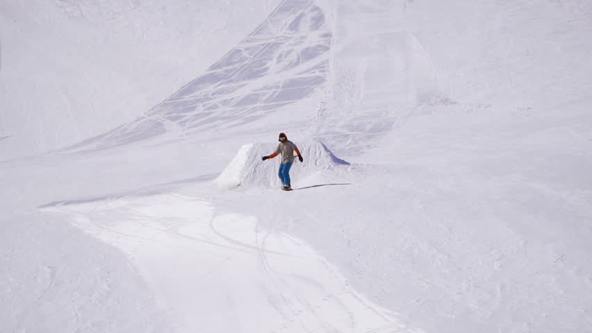 man snowboarder riding