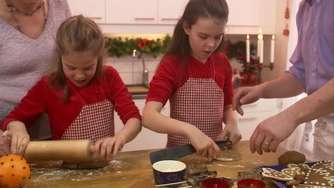 A family making gingerbread biscuits Stock Video