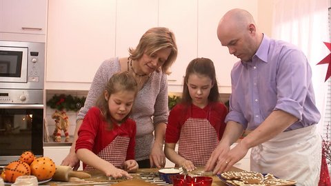 A family making gingerbread biscuits Stock Video