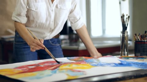 Woman artist painting watercolor paints Stockvideo