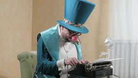 An illusionist writes on a typewriter holding a candle