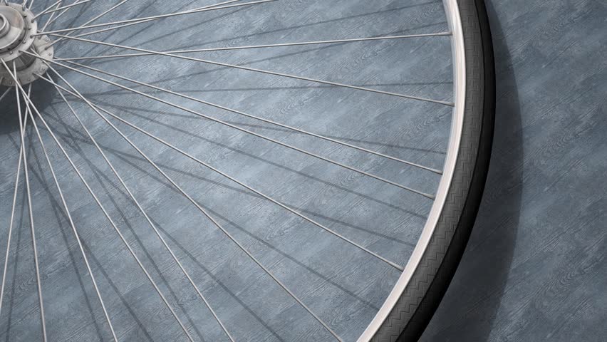 Close-up bicycle wheel spinning.