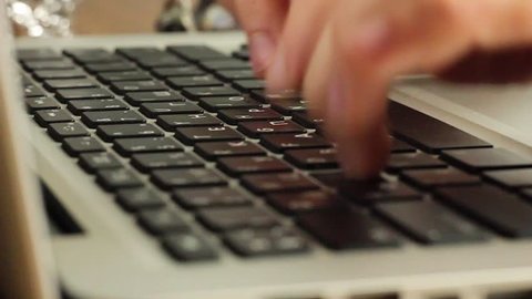 Typing keyboard laptop. Hands touch typing on a laptop keyboard. 