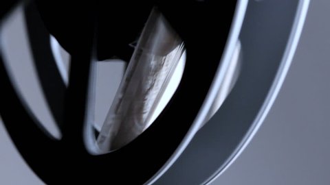 Macro shot of spinning movie reel Stock-video