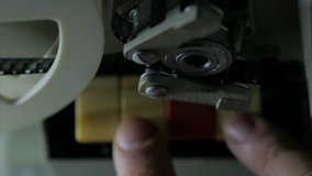 Male fingers turning on old film vintage projector. 4k