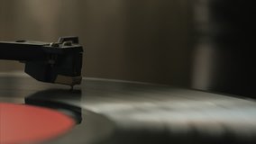 A retro-styled spinning record vinyl player. 4k. Close up.