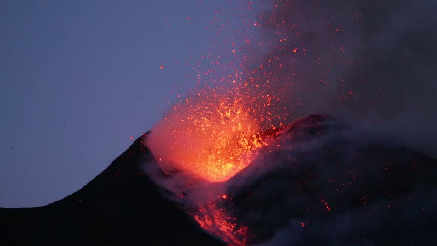 Mount Etna erupts at sunset in Sicily 