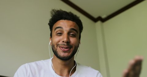 Happy Young Man Having Video Chat Call, Smiling Latin Guy Talking Online, Computer Screen Point Of View Slow Motion 60