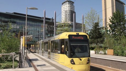 MANCHESTER, LANCASHIRE/ENGLAND - MAY 25: A brand new metrolink tram  leaves Salford Quays for Piccadilly on May 25, 2012 in Manchester. MediacityUK station opened in September 2010.
