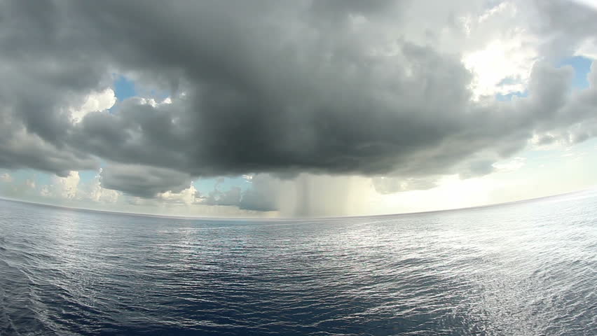 A storm in the distance over the ocean.