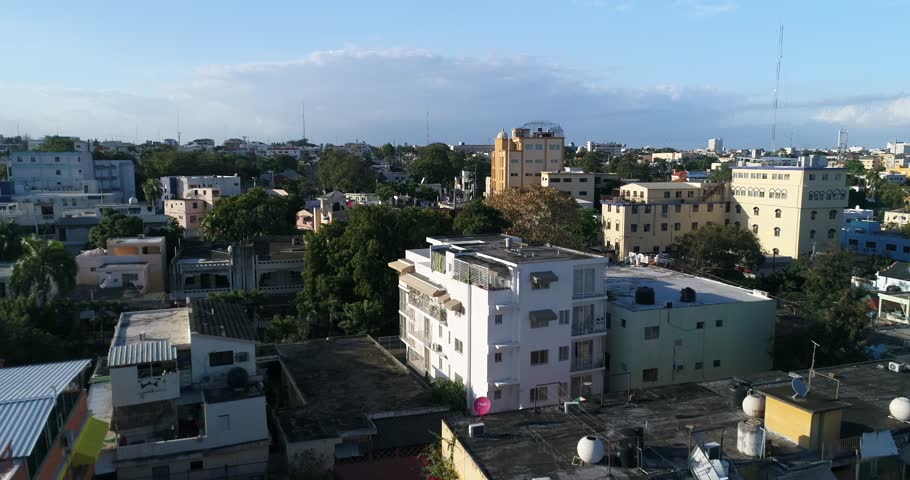 Rising aerial view past a domed palace and surrounding buildings in Santo Domingo, Dominican Republic, 2017.