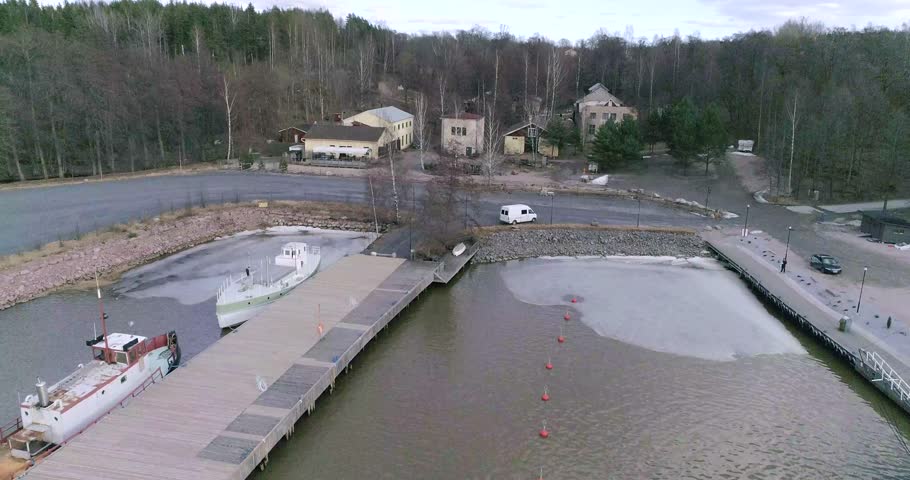 Teijon ruukkikylat, Cinema 4k tilt up aerial of the steelworks in matildanlaakso, on a sunny spring day, in, Salo, Finland