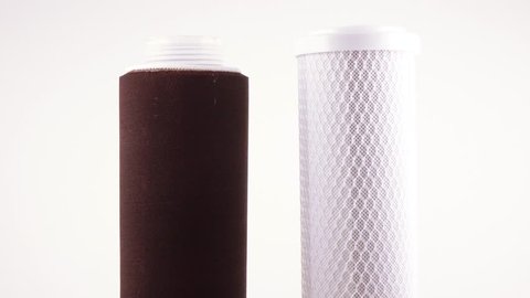 The filter for drinking water filtering a cartridge for system of house water purification on a white background